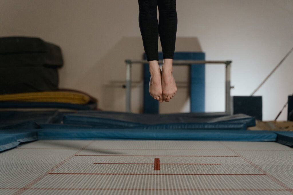 a person jumping on a trampoline